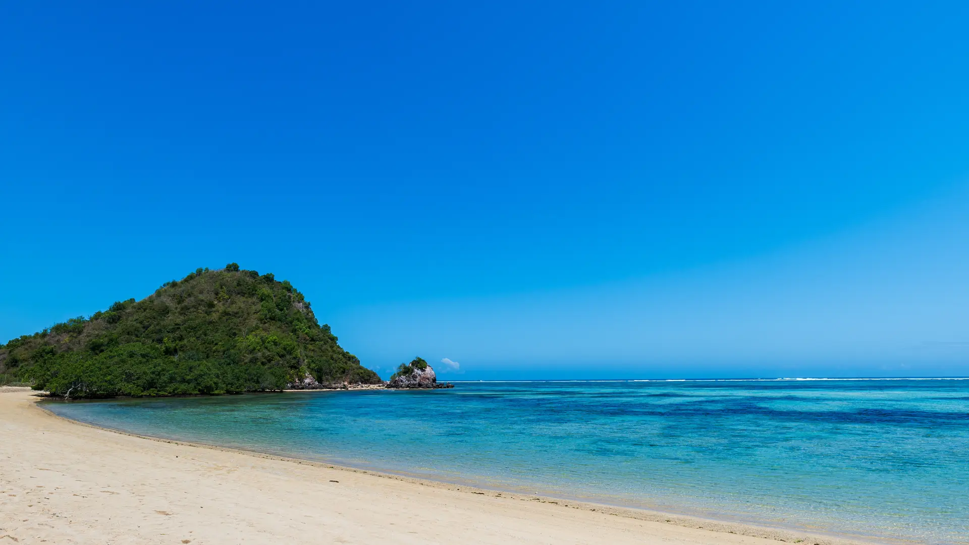 Lombok, Indonesia, Beach ocean landscape with unidentifiable people for surfing at Selong beach area. Lombok is an island in West Nusa Tenggara province, Indonesia.