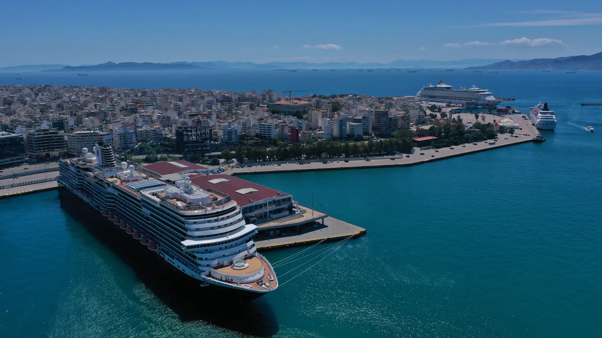 Aerial top view photo of huge cruise ship docked in port of Piraeus one of the largest in Europe, Attica, Greece