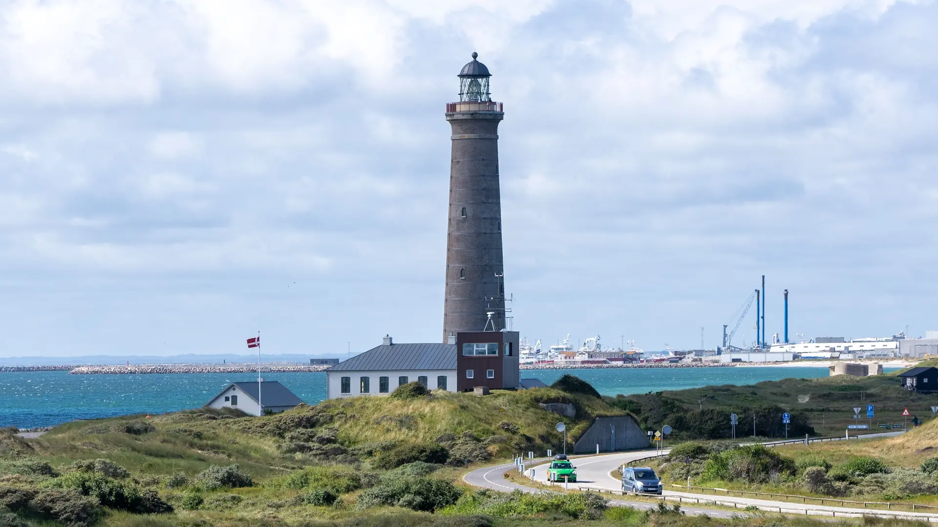 The Skagen lighthouse standing proudly on a beach in Denmark.