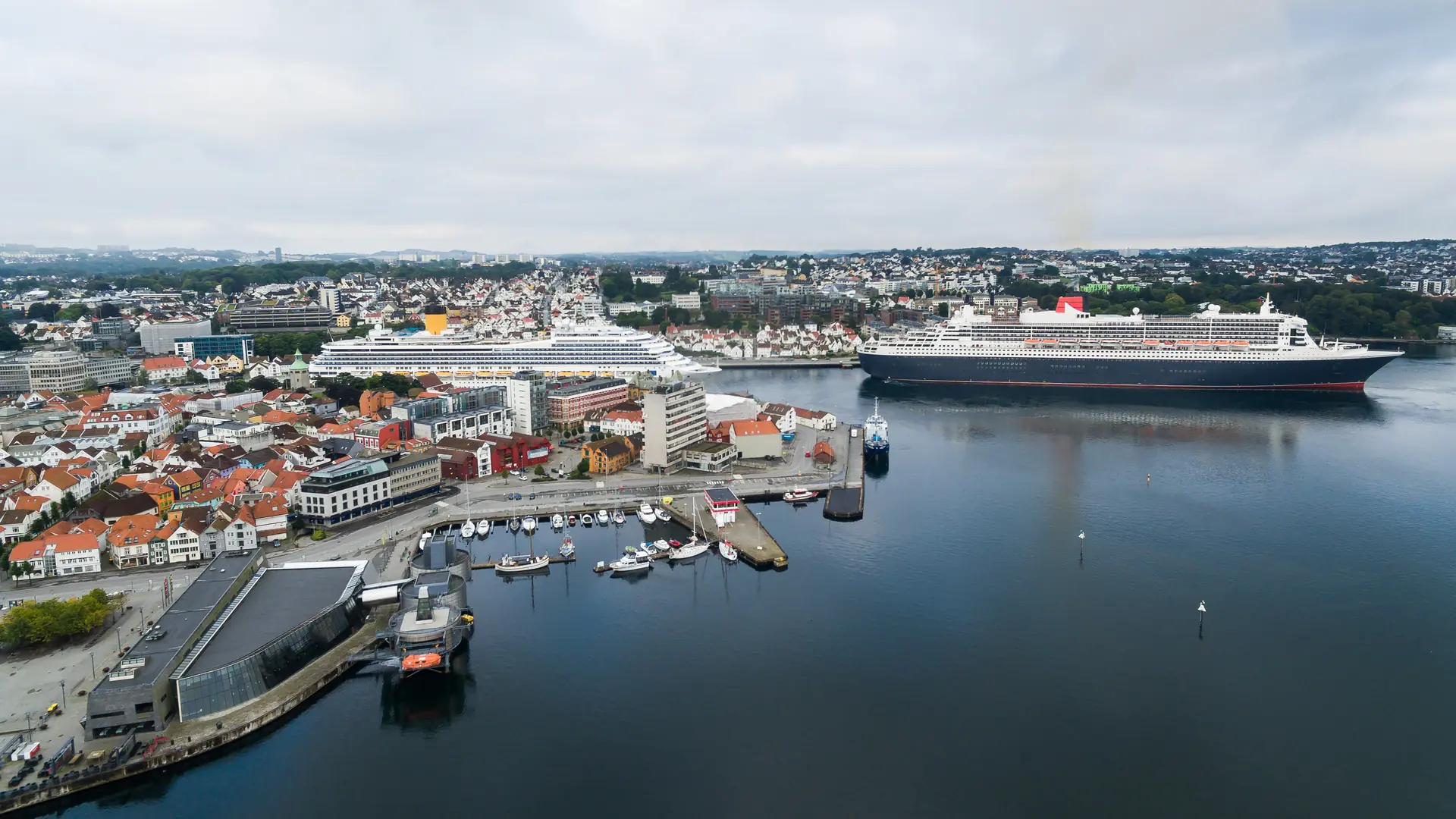 Cruise ships in a harbor of Stavanger at morning, aerial view