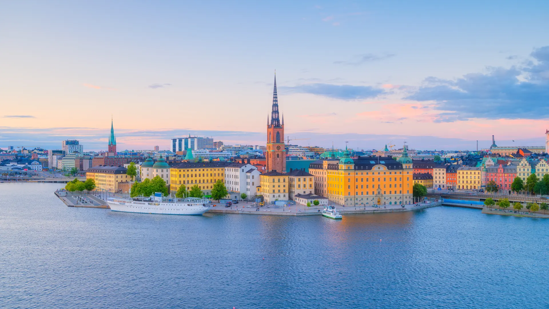 Stockholm, Sweden. Panoramic view of the Gamla Stan. The capital of Sweden. Cityscape during sunset. View of the old town in Stockholm. Photo for background, wallpaper, postcards.