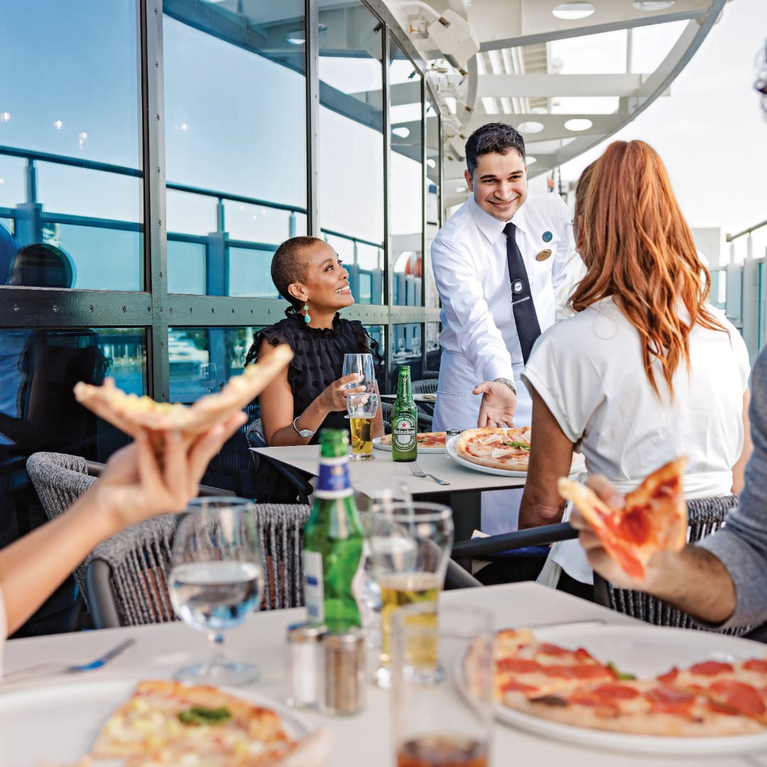 Waiter serving Pizza
