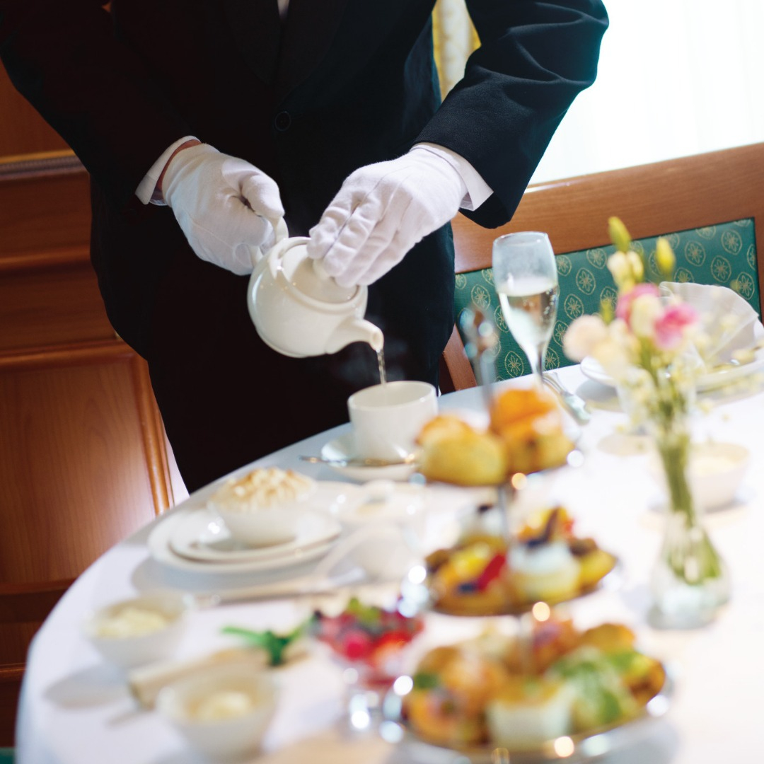 Server pouring tea