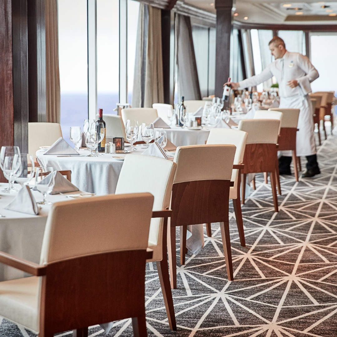 Waiter setting up tables