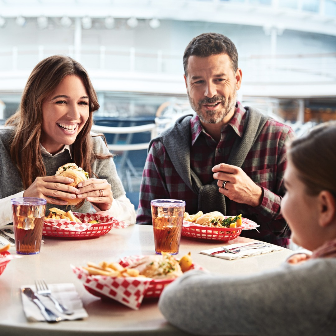 family at table eating burger meals
